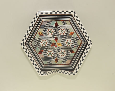 Coaster – "أصالة الخشب" (Asalat al-Khishab) – "Essence of Wood"