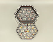 Coaster – "أصالة الخشب" (Asalat al-Khishab) – "Essence of Wood"
