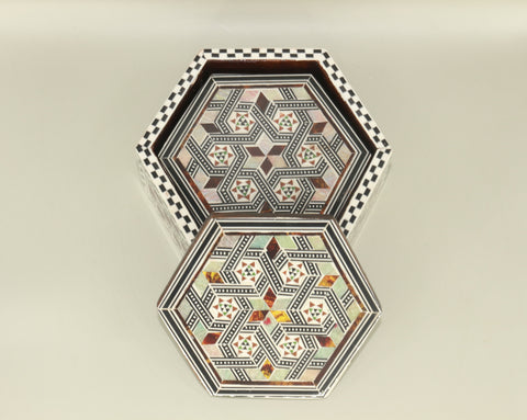 Coaster – "أصالة الخشب" (Asalat al-Khishab) – "Essence of Wood"