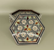 Coaster – "أصالة الخشب" (Asalat al-Khishab) – "Essence of Wood"