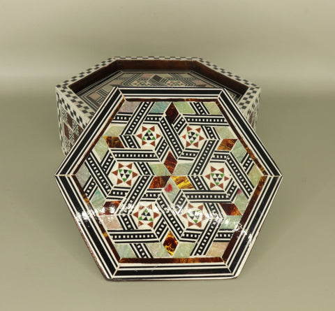 Coaster – "أصالة الخشب" (Asalat al-Khishab) – "Essence of Wood"